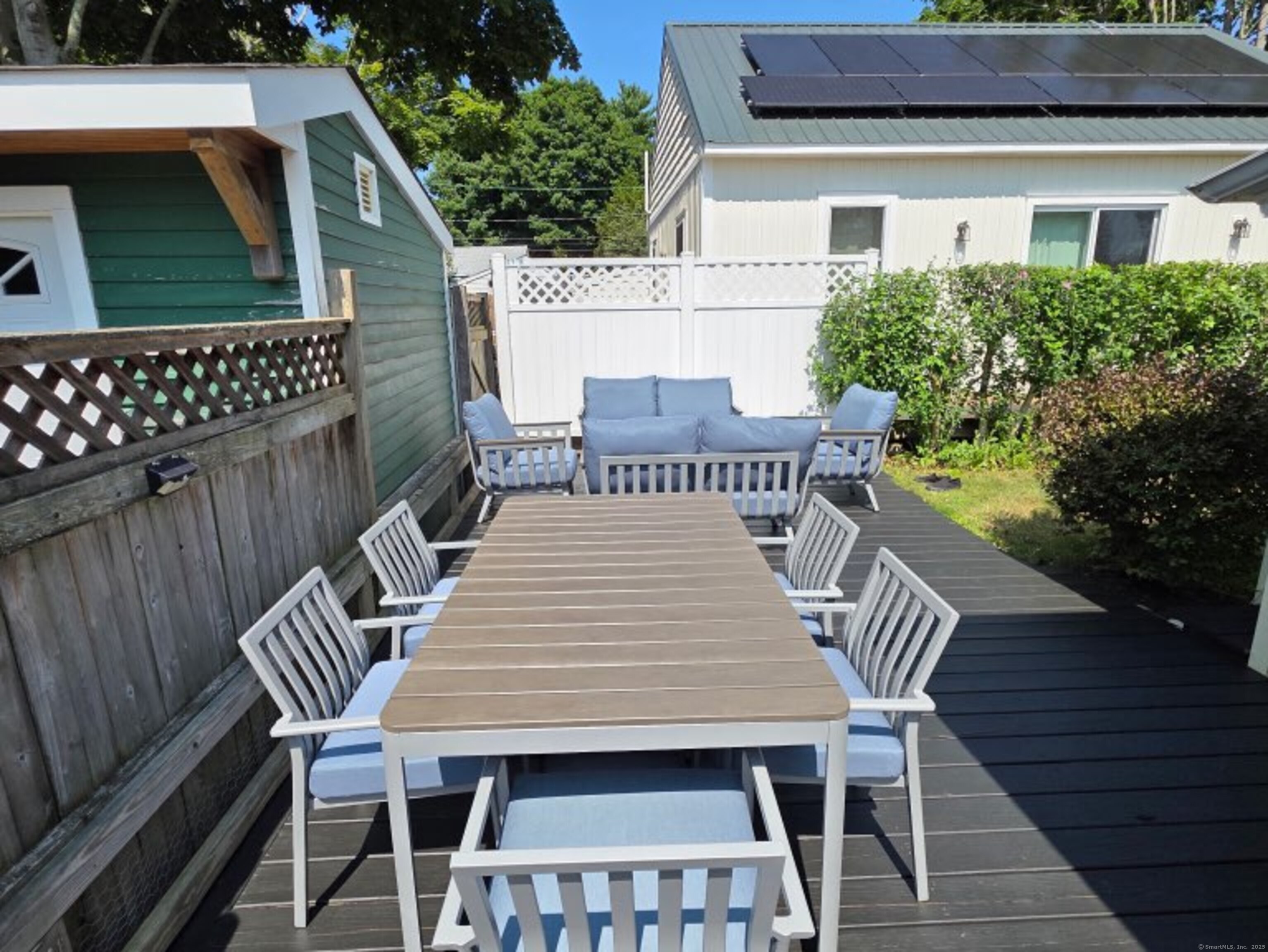 7 3rd Street Madison, CT 06443 - Photo 13 of 23 a view of a patio with a table and chairs