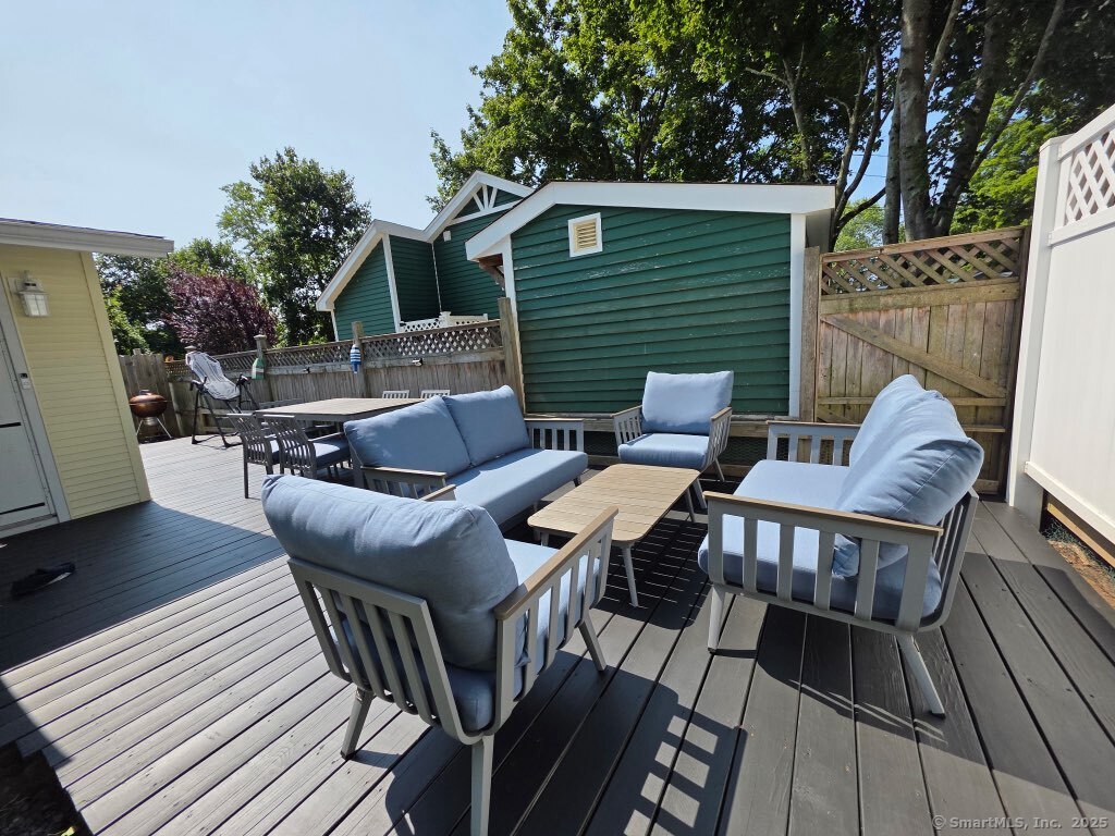 7 3rd Street Madison, CT 06443 - Photo 14 of 23 a backyard of a house with table and chairs