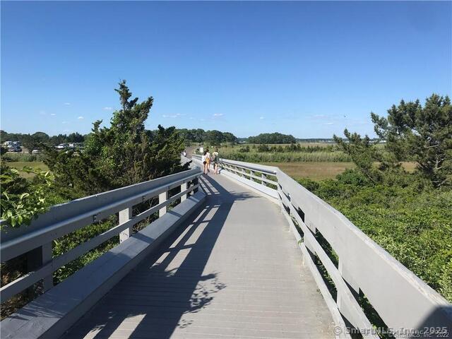 7 3rd Street Madison, CT 06443 - Photo 17 of 23 a view of a two large window and a wooden bridge