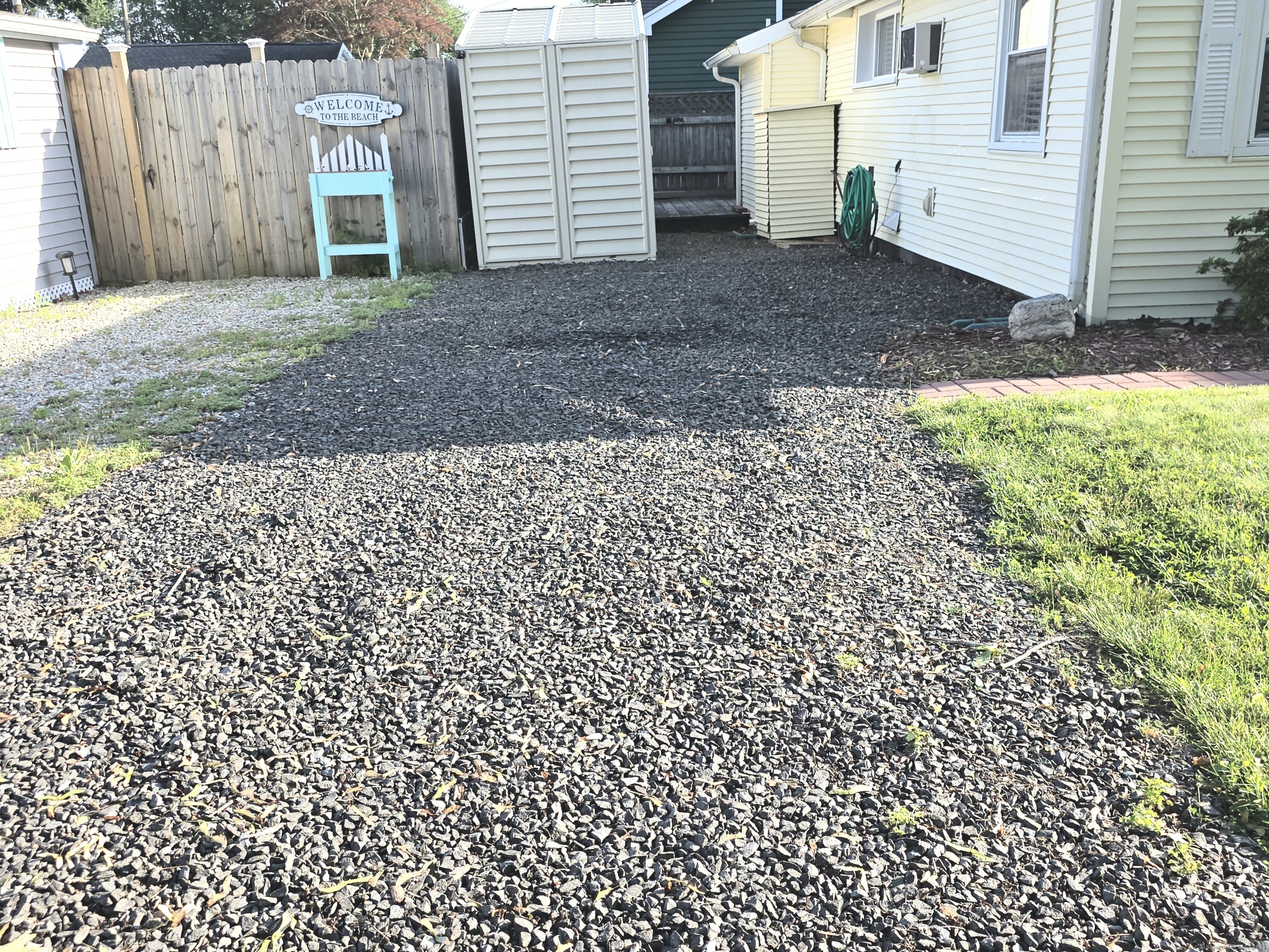 7 3rd Street Madison, CT 06443 - Photo 20 of 23 a view of a house with a backyard