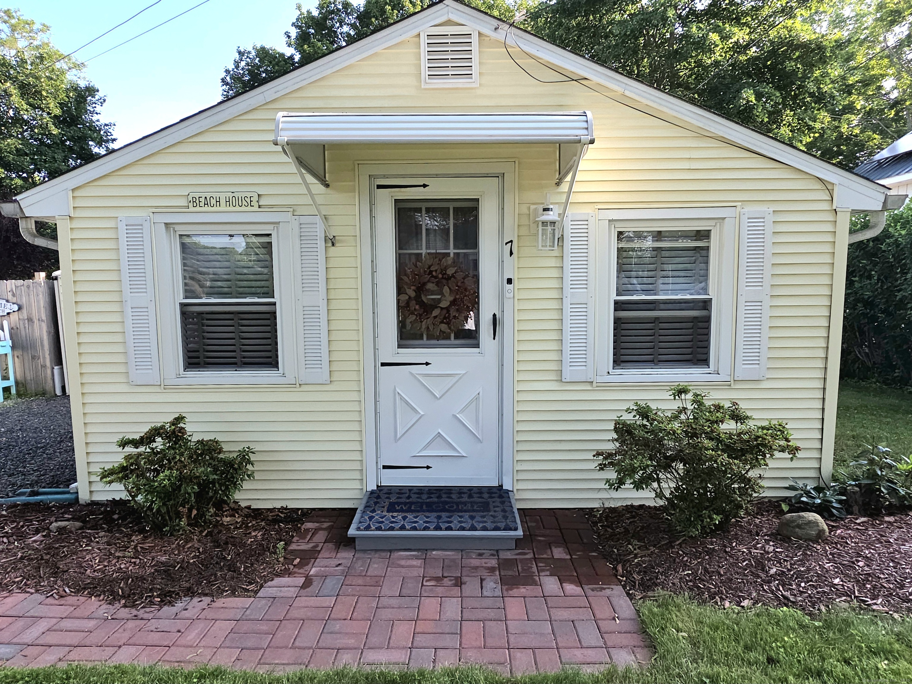7 3rd Street Madison, CT 06443 - Photo 3 of 23 a view of a house with a yard