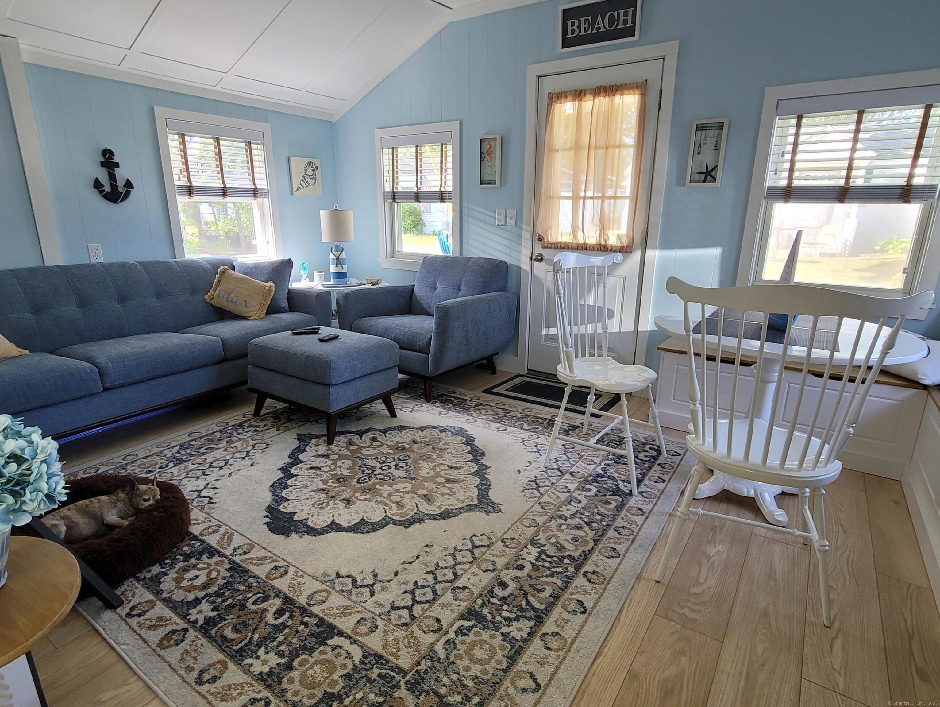 7 3rd Street Madison, CT 06443 - Photo 6 of 23 a living room with furniture and a large window