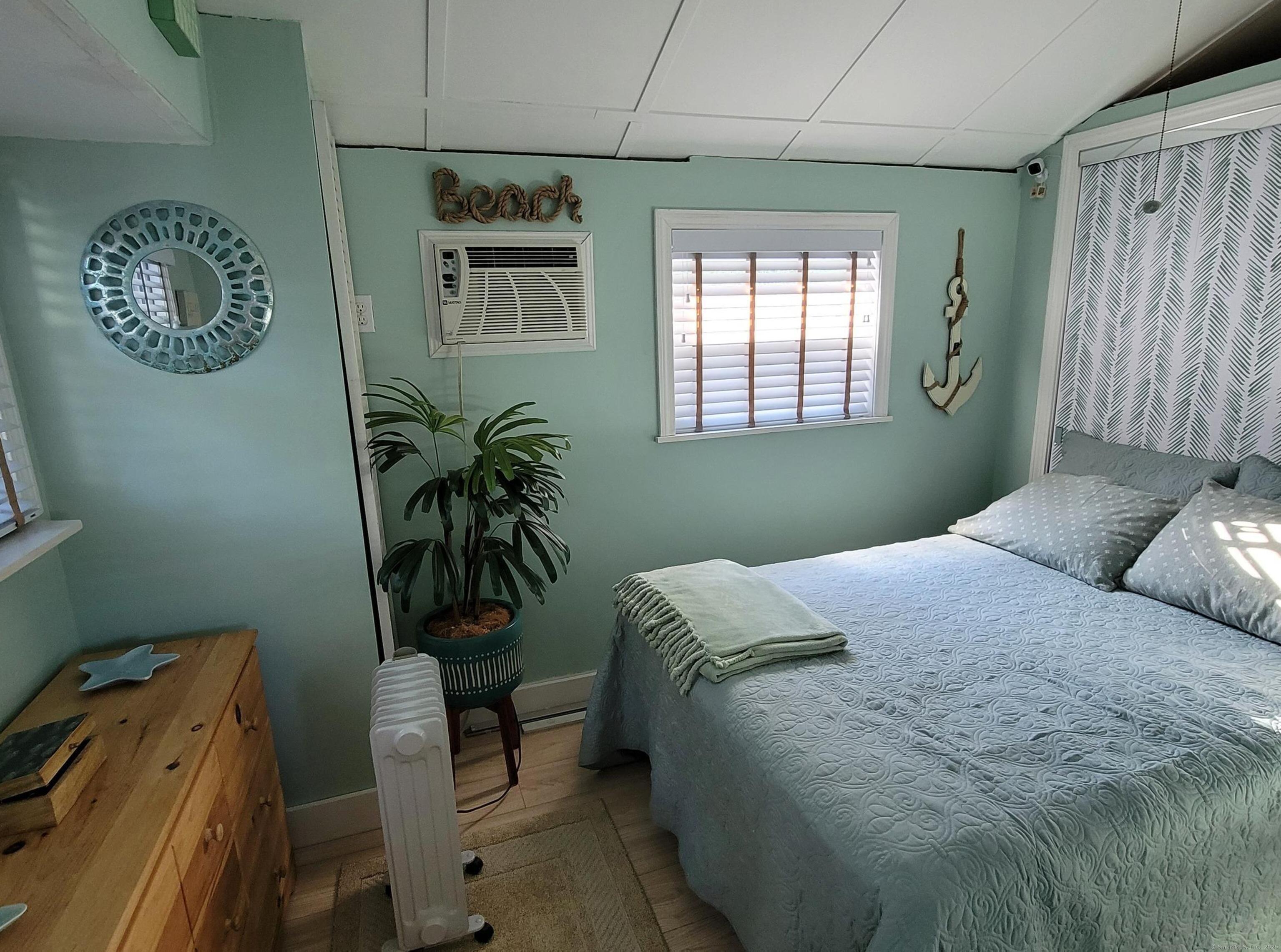 7 3rd Street Madison, CT 06443 - Photo 8 of 23 a bedroom with a bed and a window