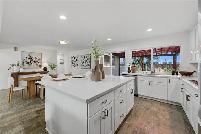 a kitchen with a table and chairs in it