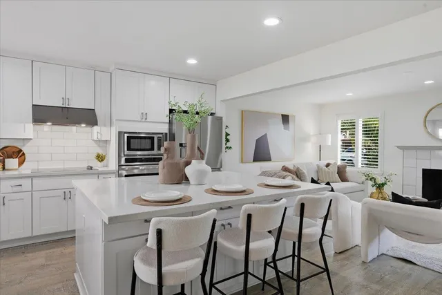 a bedroom with furniture and wooden floor