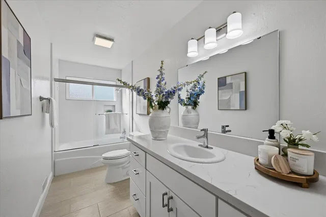 a patio with table and chairs