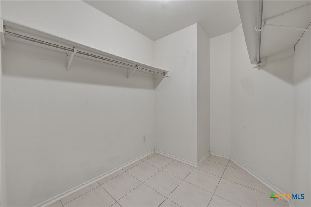 109 Comal Cove Elgin, TX 78621 - Photo 25 of 34 a view of an empty walk in closet