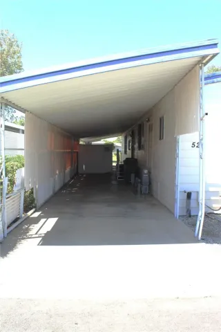 a view of a porch with wooden floor and stairs