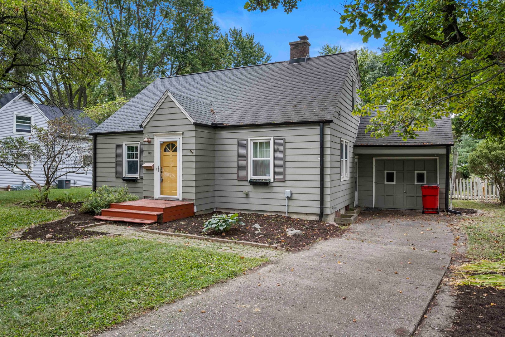 1009 West Columbia Avenue Champaign, IL 61821 - Photo 2 of 10 a front view of a house with garden