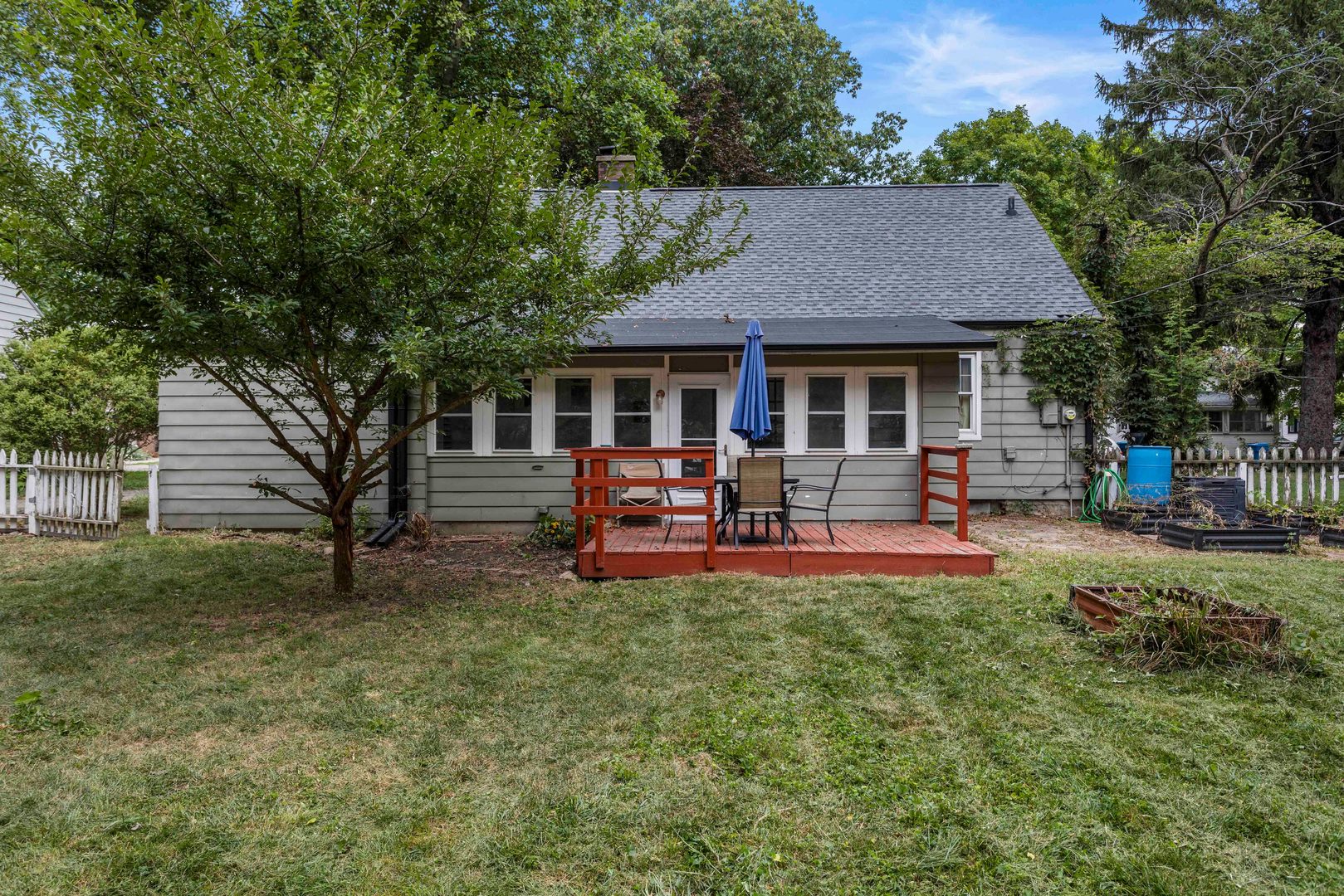 1009 West Columbia Avenue Champaign, IL 61821 - Photo 5 of 10 a view of a house with swimming pool and sitting area