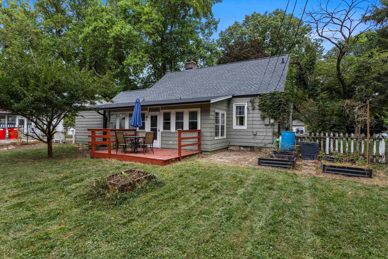 1009 West Columbia Avenue Champaign, IL 61821 - Photo 6 of 10 a view of a house with backyard and a tree