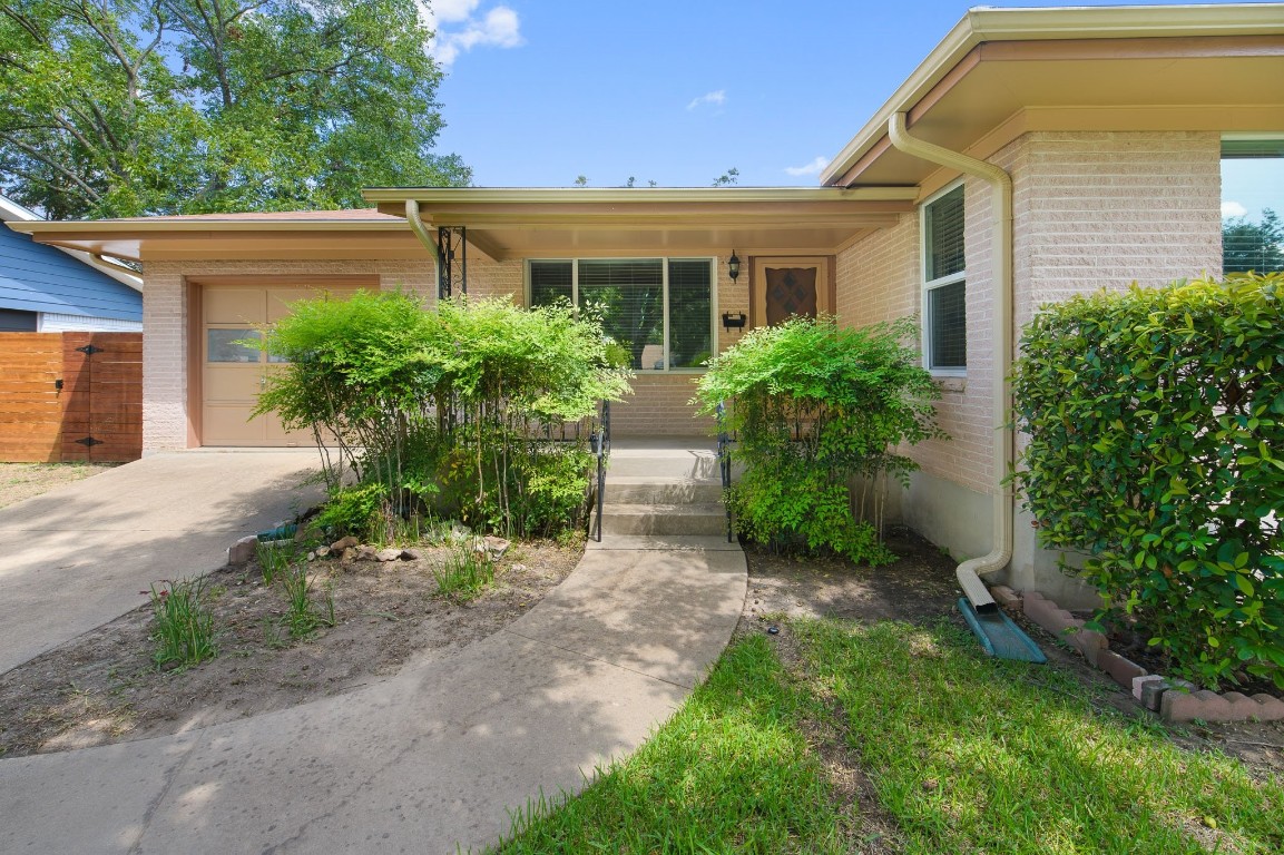 1908 Redlands Street Austin, TX 78757 - Photo 1 of 1 a view of a front of house with potted plants