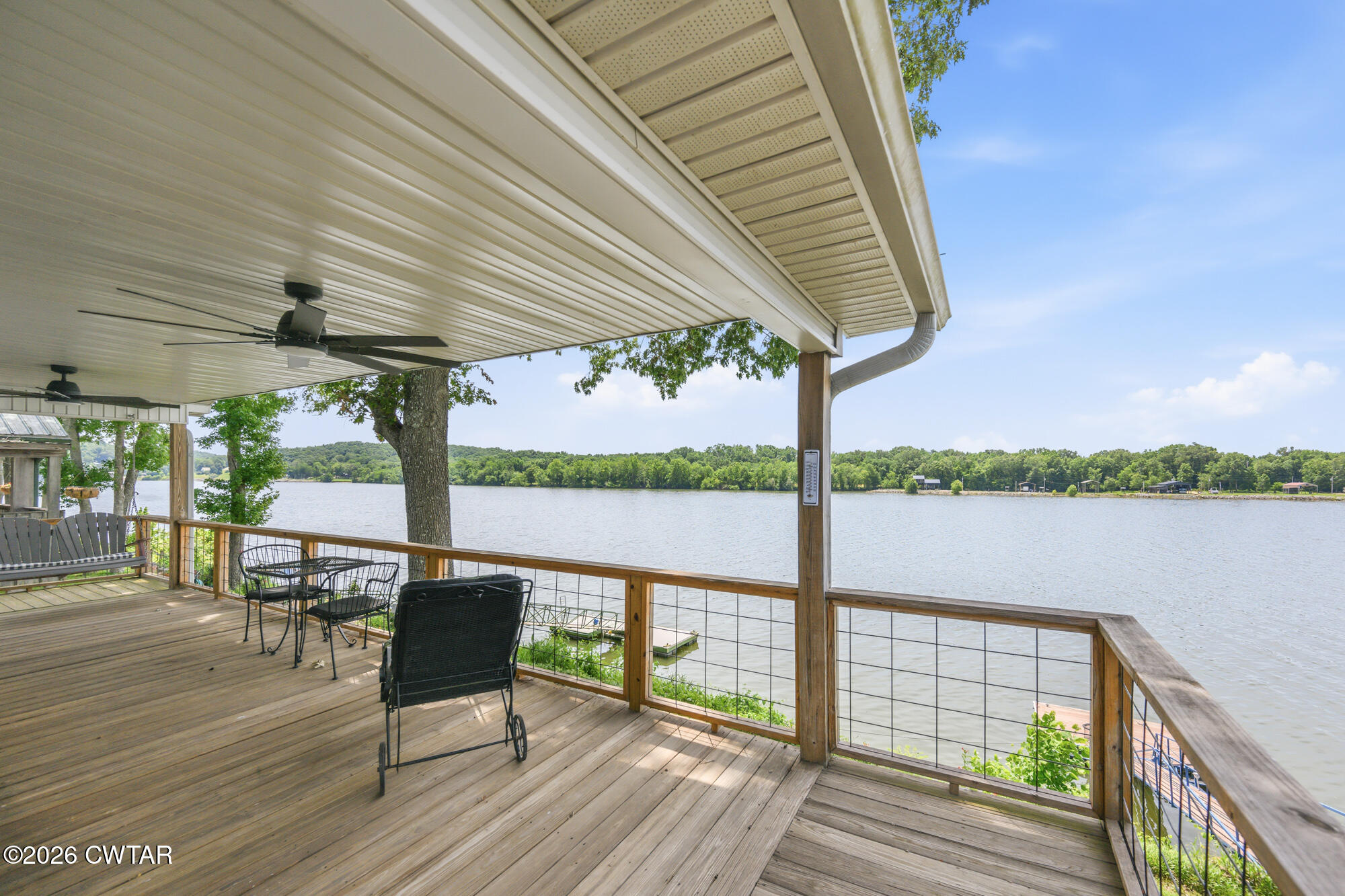 1728 Yarbro Landing Lane Decaturville, TN 38329 - Photo 25 of 44 a view of a balcony with chairs and wooden floor