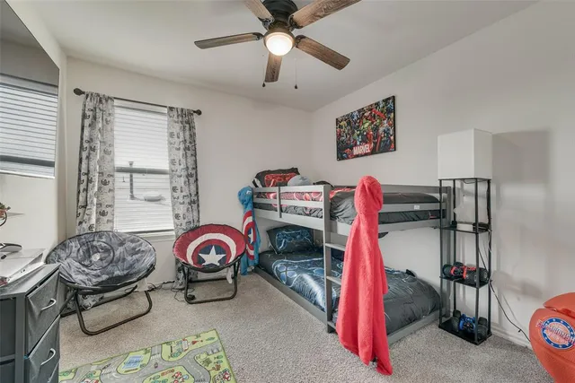 a bedroom with furniture and a bed