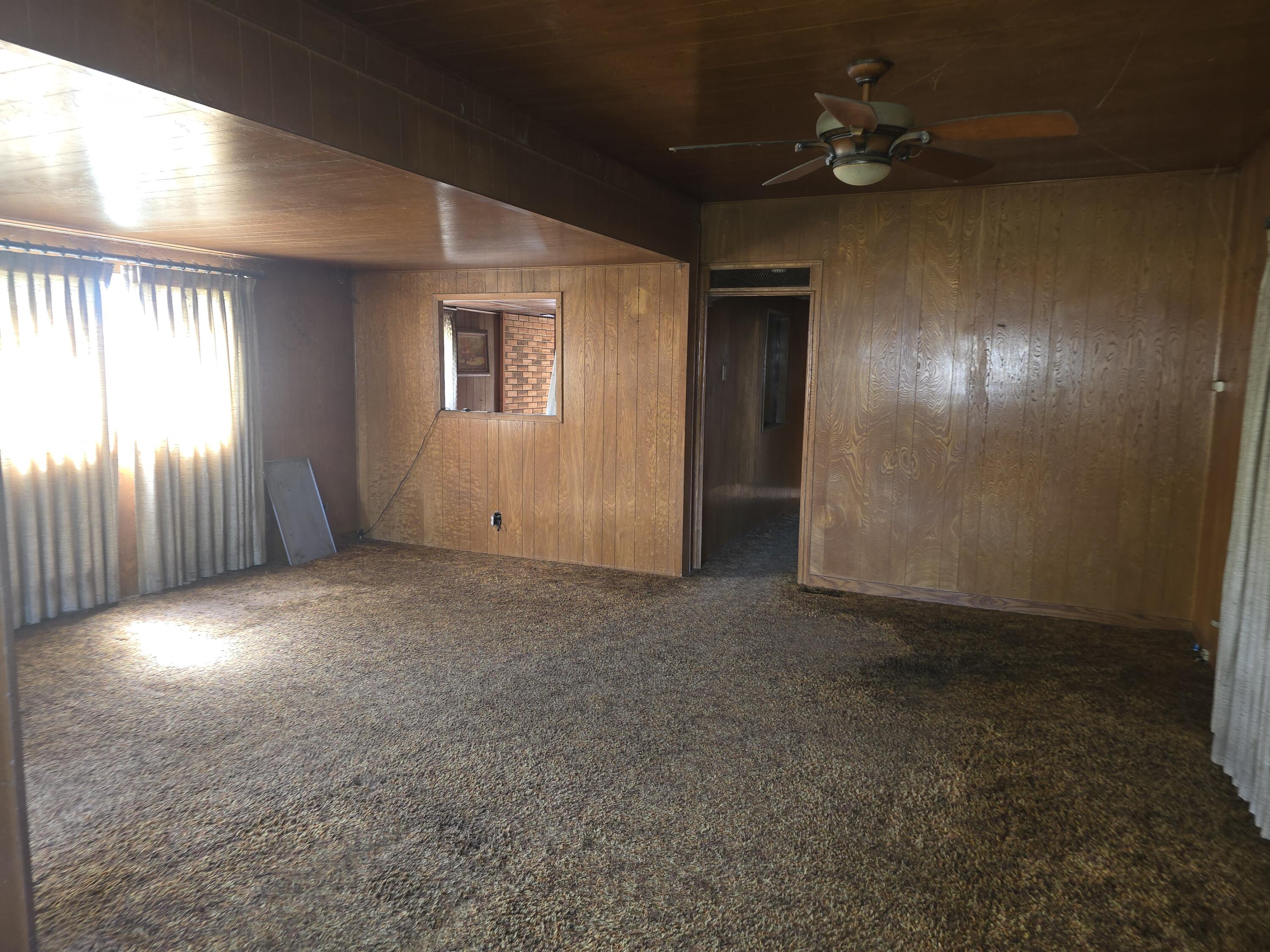 31974 Drews Road Chiloquin, OR 97624 - Photo 6 of 25 wooden floor in an empty room with a window
