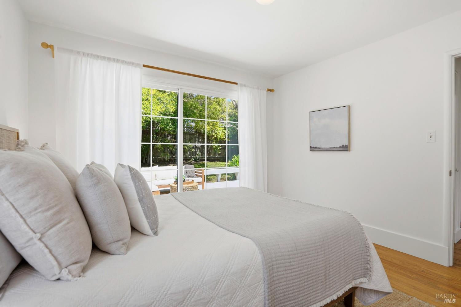 234 Solano Street San Rafael, CA 94901 - Photo 9 of 24 a bedroom with a bed and a large window