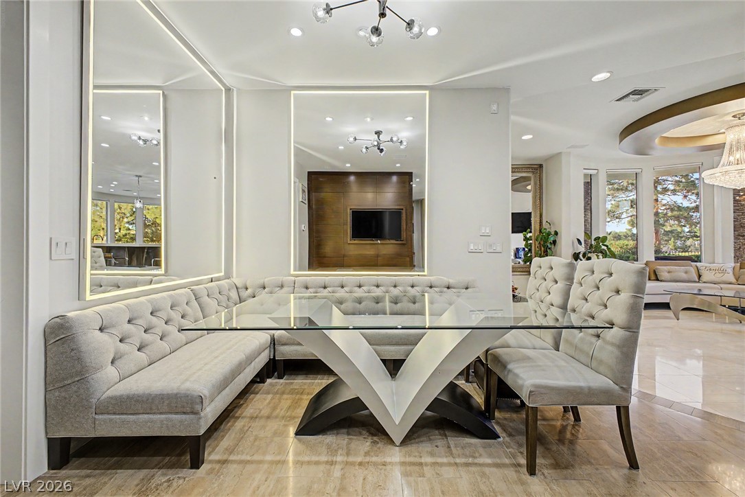 46 Gulf Stream Court Las Vegas, NV 89113 - Photo 17 of 62 This exquisite dining area showcases elegant design with a sophisticated eating space and polished flooring.