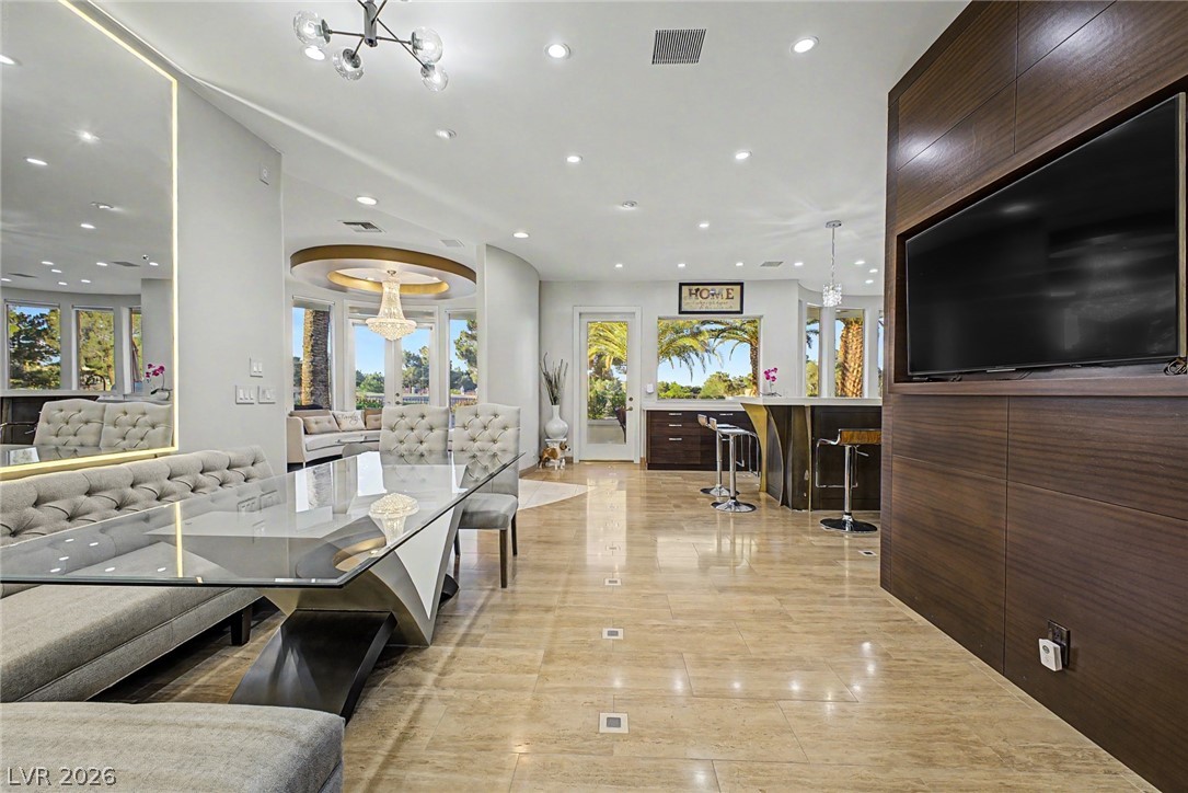 46 Gulf Stream Court Las Vegas, NV 89113 - Photo 18 of 62 This open concept living space features high ceilings and beautiful tile flooring, perfect for entertaining.