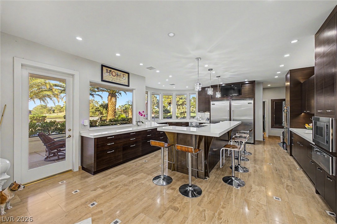 46 Gulf Stream Court Las Vegas, NV 89113 - Photo 20 of 62 This spacious kitchen features ample counter space, modern appliances, and a seamless connection to the outdoor living area.