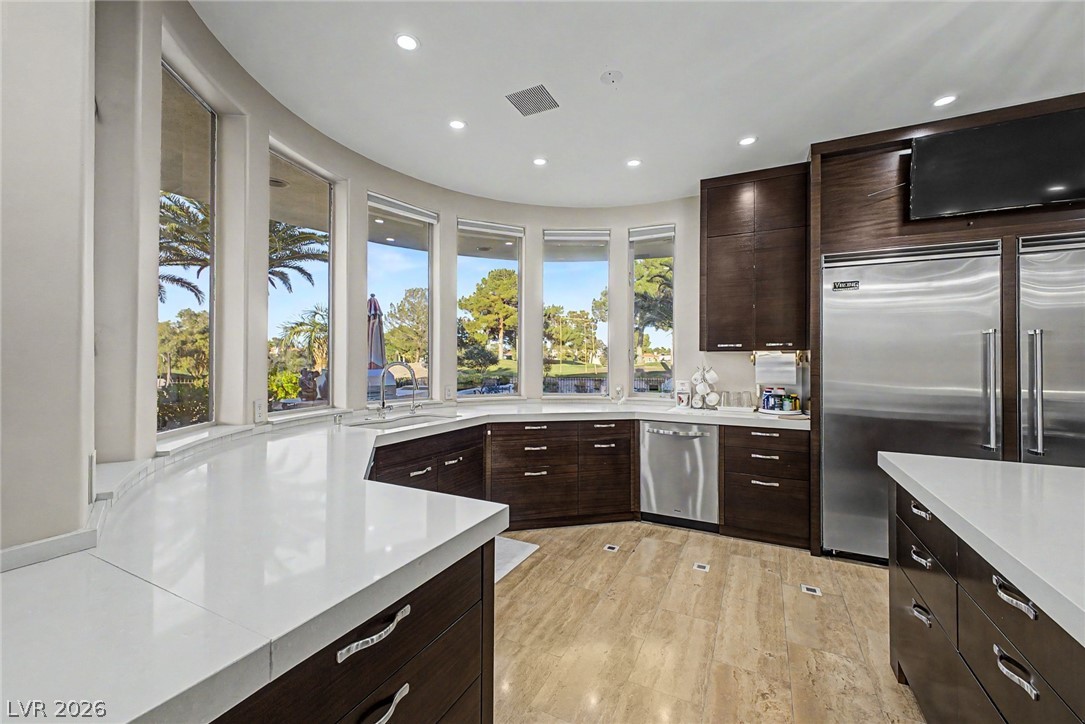 46 Gulf Stream Court Las Vegas, NV 89113 - Photo 21 of 62 This spacious kitchen offers ample countertop space and a picturesque outdoor view.