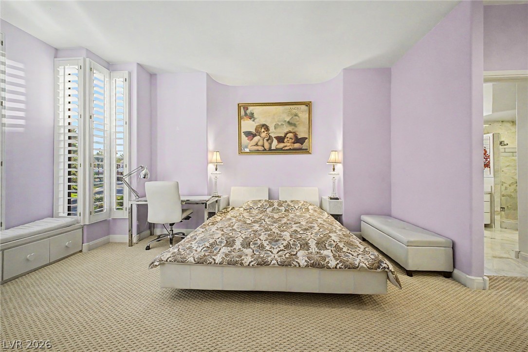 46 Gulf Stream Court Las Vegas, NV 89113 - Photo 25 of 62 This spacious bedroom offers comfortable carpeting and elegant plantation shutters.