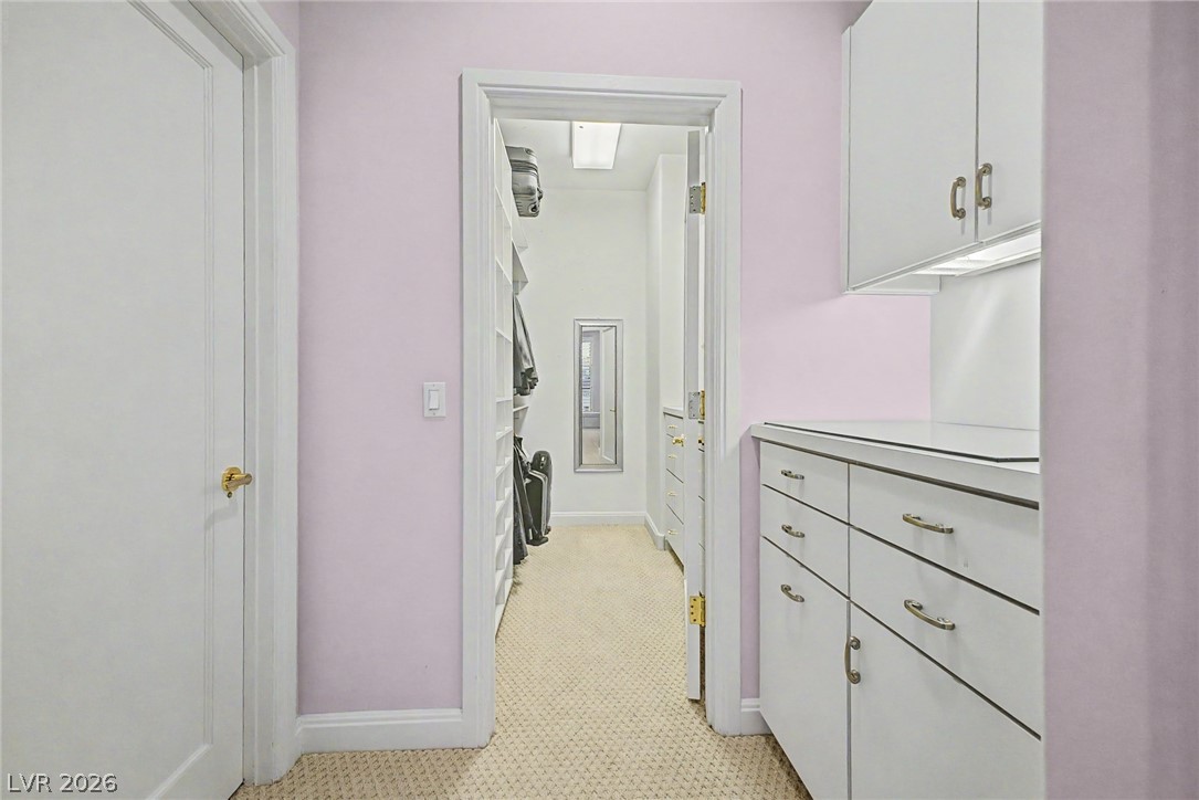 46 Gulf Stream Court Las Vegas, NV 89113 - Photo 28 of 62 This spacious closet features ample storage solutions and convenient access to a private dressing area.