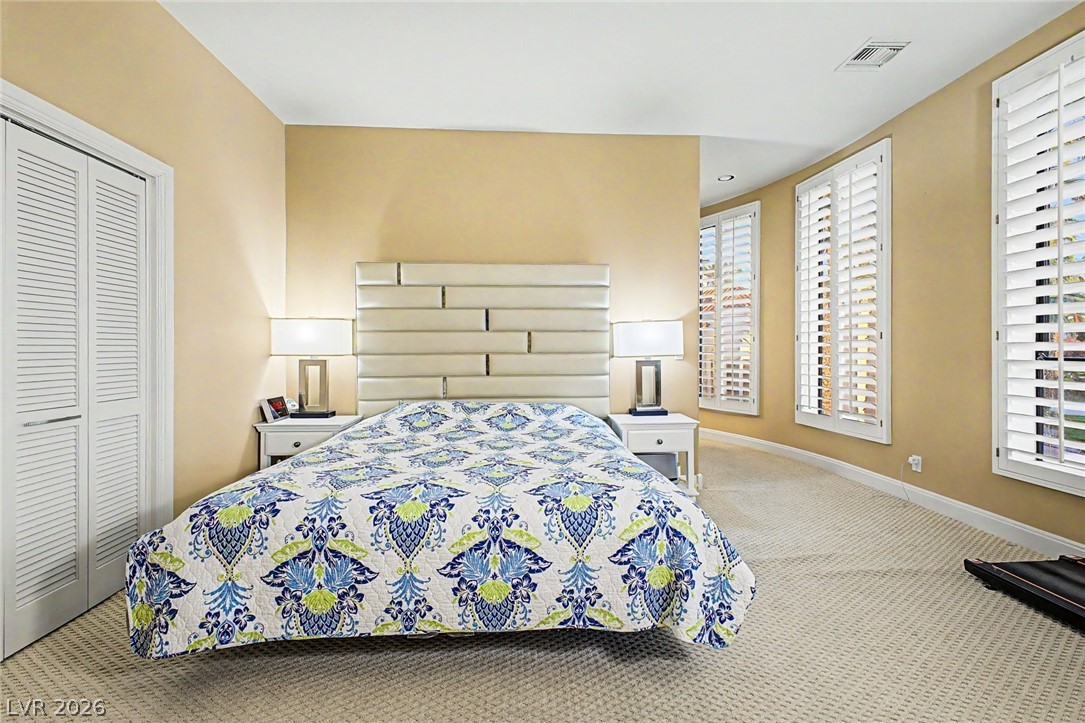 46 Gulf Stream Court Las Vegas, NV 89113 - Photo 30 of 62 This spacious bedroom offers serene comfort and abundant natural light.