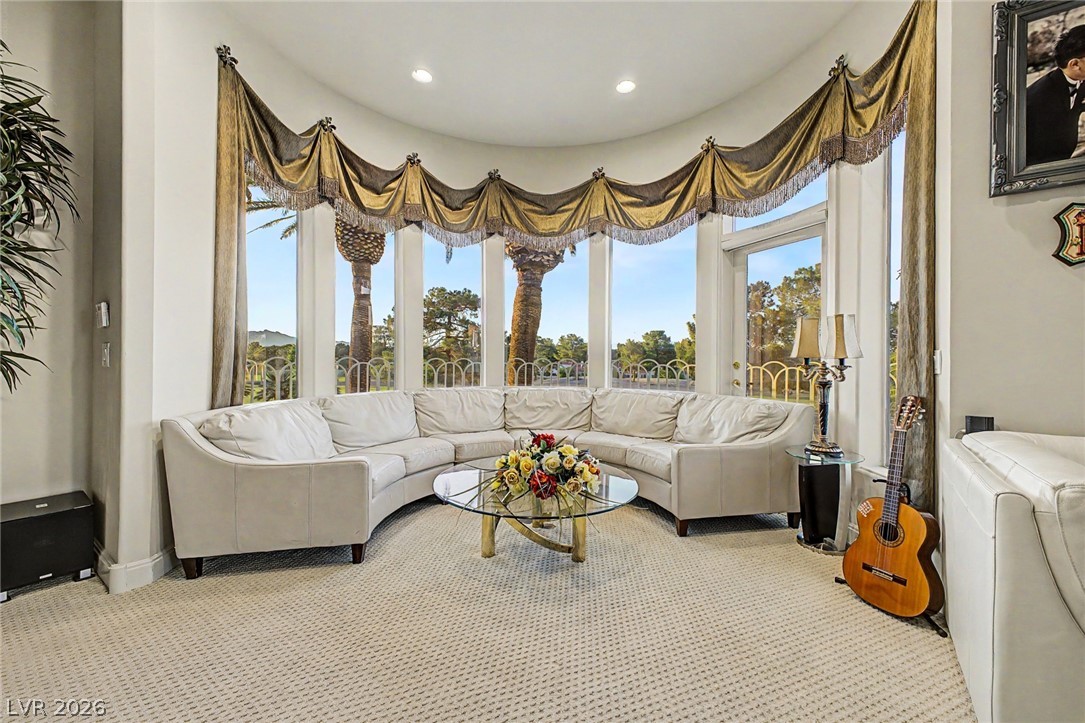 46 Gulf Stream Court Las Vegas, NV 89113 - Photo 36 of 62 This living room features expansive windows offering picturesque views and ample natural light.