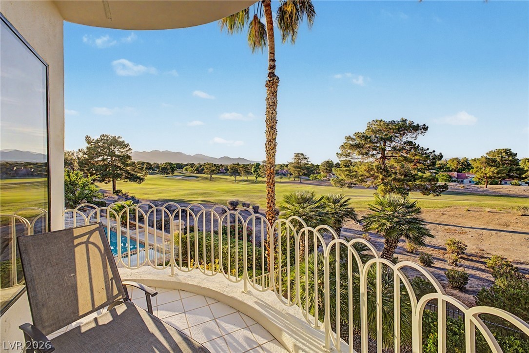 46 Gulf Stream Court Las Vegas, NV 89113 - Photo 4 of 62 Enjoy expansive golf course views and distant mountain vistas from this spacious outdoor balcony.