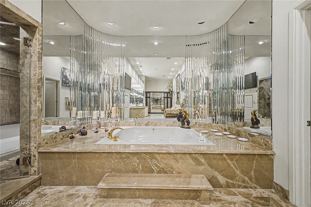 46 Gulf Stream Court Las Vegas, NV 89113 - Photo 40 of 62 This spacious primary bathroom features luxurious finishes and an expansive soaking tub.