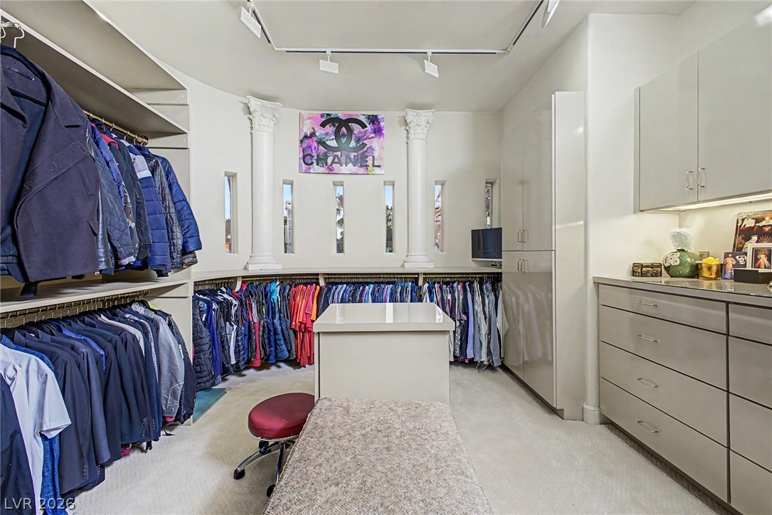 46 Gulf Stream Court Las Vegas, NV 89113 - Photo 43 of 62 This spacious closet offers ample storage and a sophisticated, organized environment for clothing.