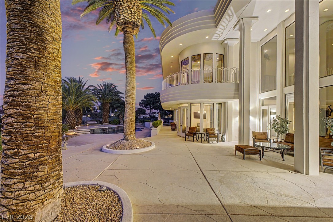 46 Gulf Stream Court Las Vegas, NV 89113 - Photo 51 of 62 This magnificent residence boasts a grand exterior with a spacious patio, perfect for outdoor living.