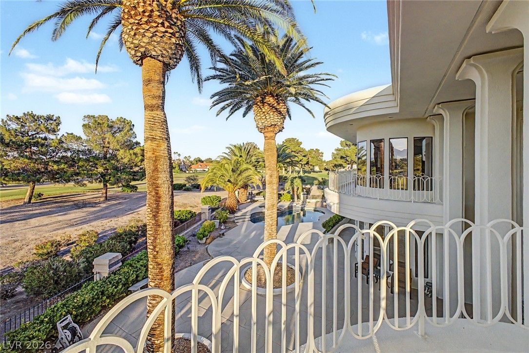 46 Gulf Stream Court Las Vegas, NV 89113 - Photo 53 of 62 This captivating exterior offers expansive views of lush greenery and a sparkling pool, perfect for serene living.