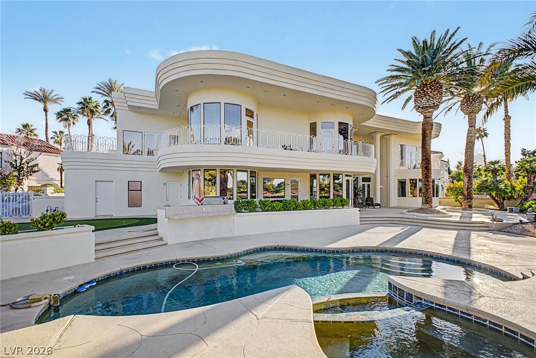 46 Gulf Stream Court Las Vegas, NV 89113 - Photo 57 of 62 This exquisite home boasts expansive outdoor living with a private pool, spa, and mature landscaping.