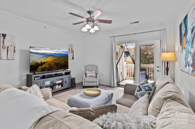 a living room with furniture and a flat screen tv