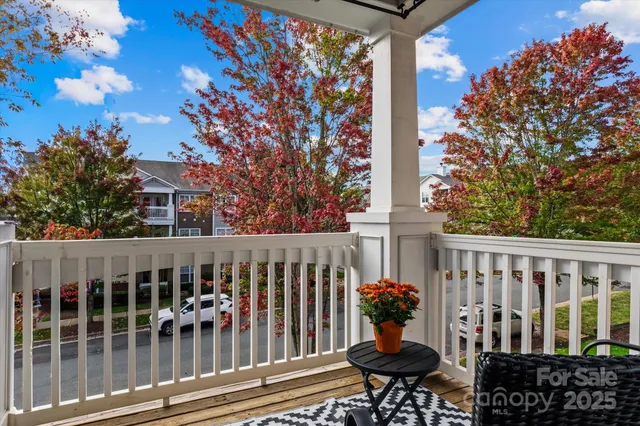 a view of a chairs and table in the balcony