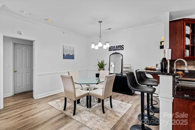 a view of a workspace with furniture and gym equipment