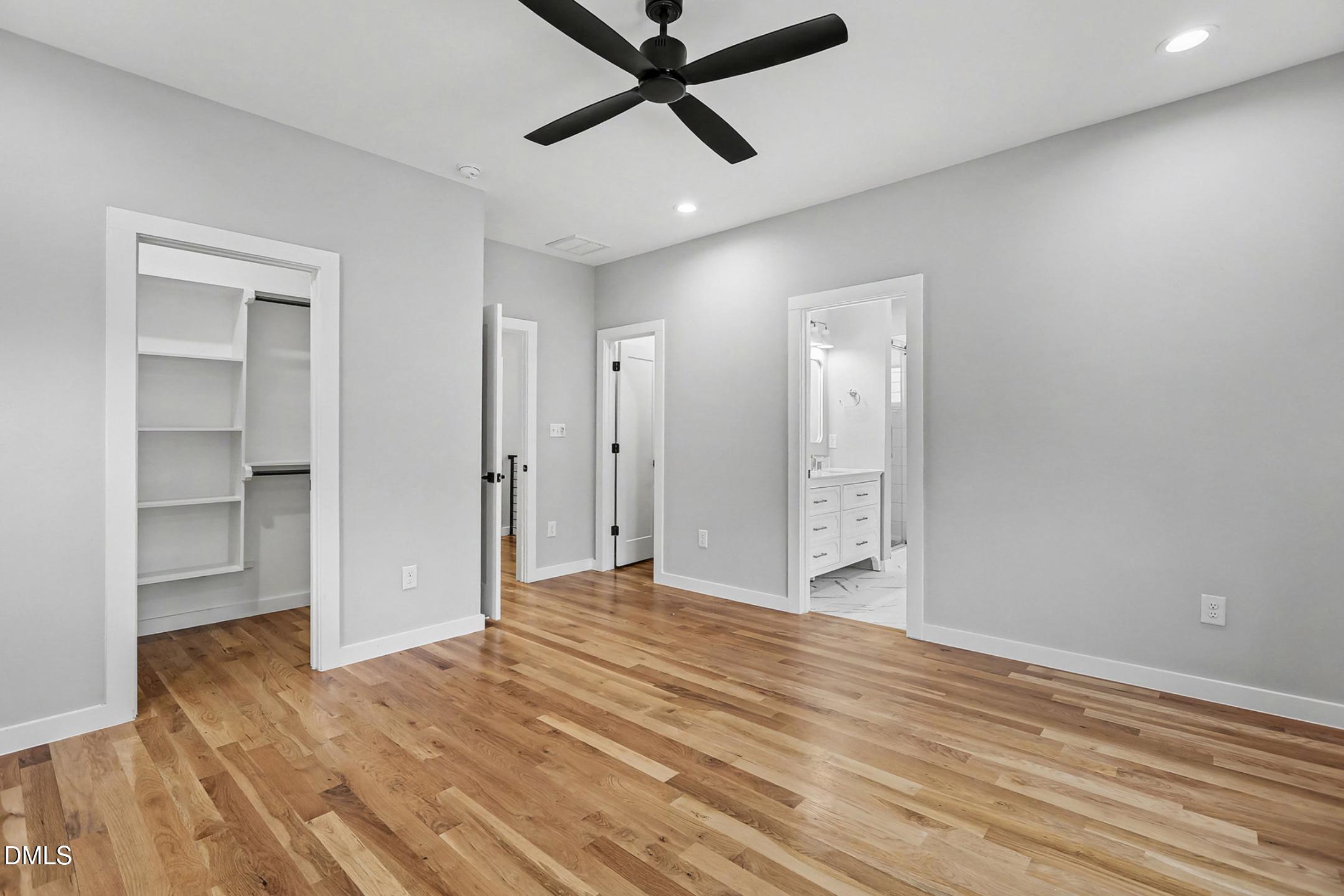 1508 East Jones Street Raleigh, NC 27610 - Photo 28 of 38 a view of empty room with wooden floor and ceiling fan