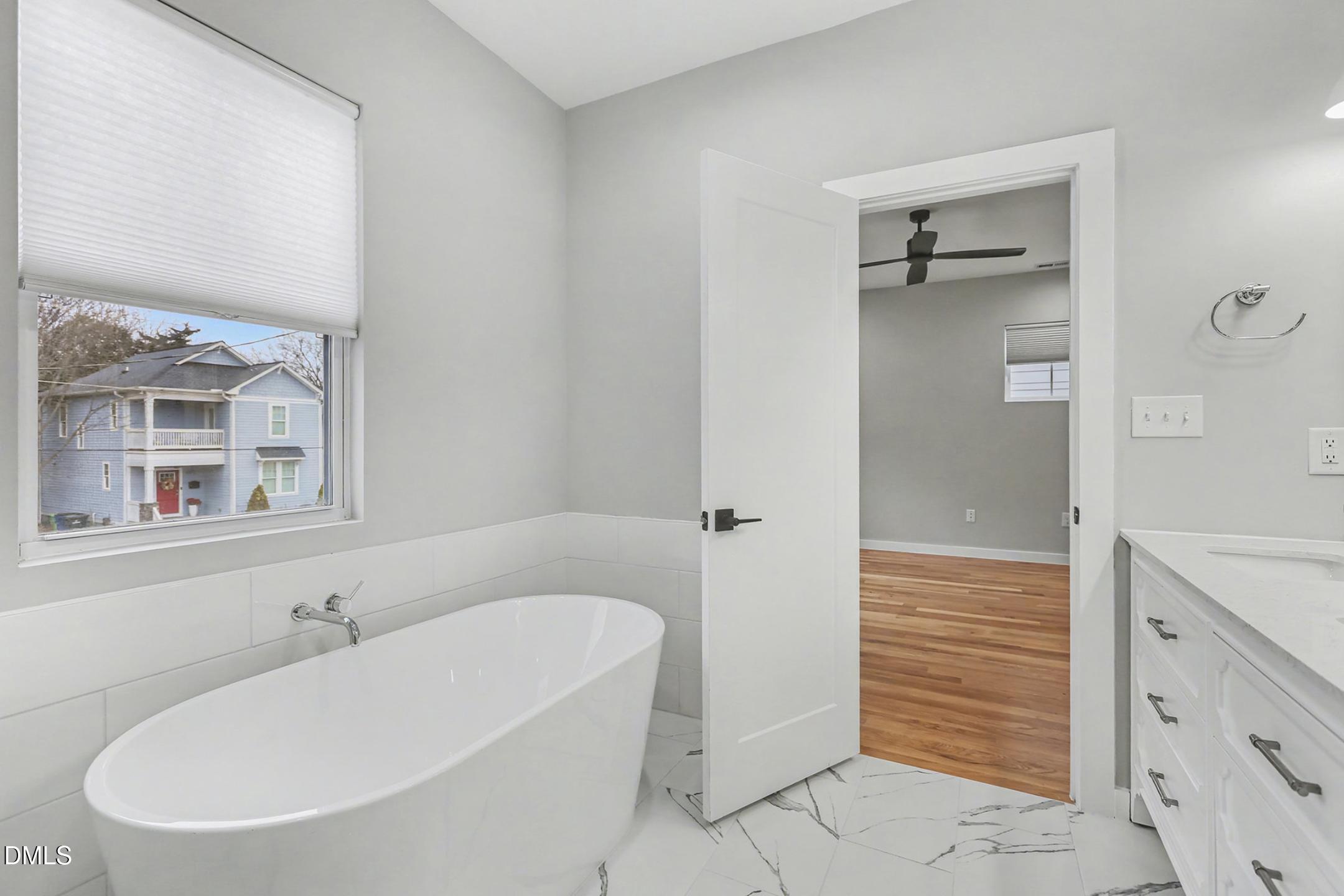 1508 East Jones Street Raleigh, NC 27610 - Photo 31 of 38 a bathroom with a bathtub and a sink