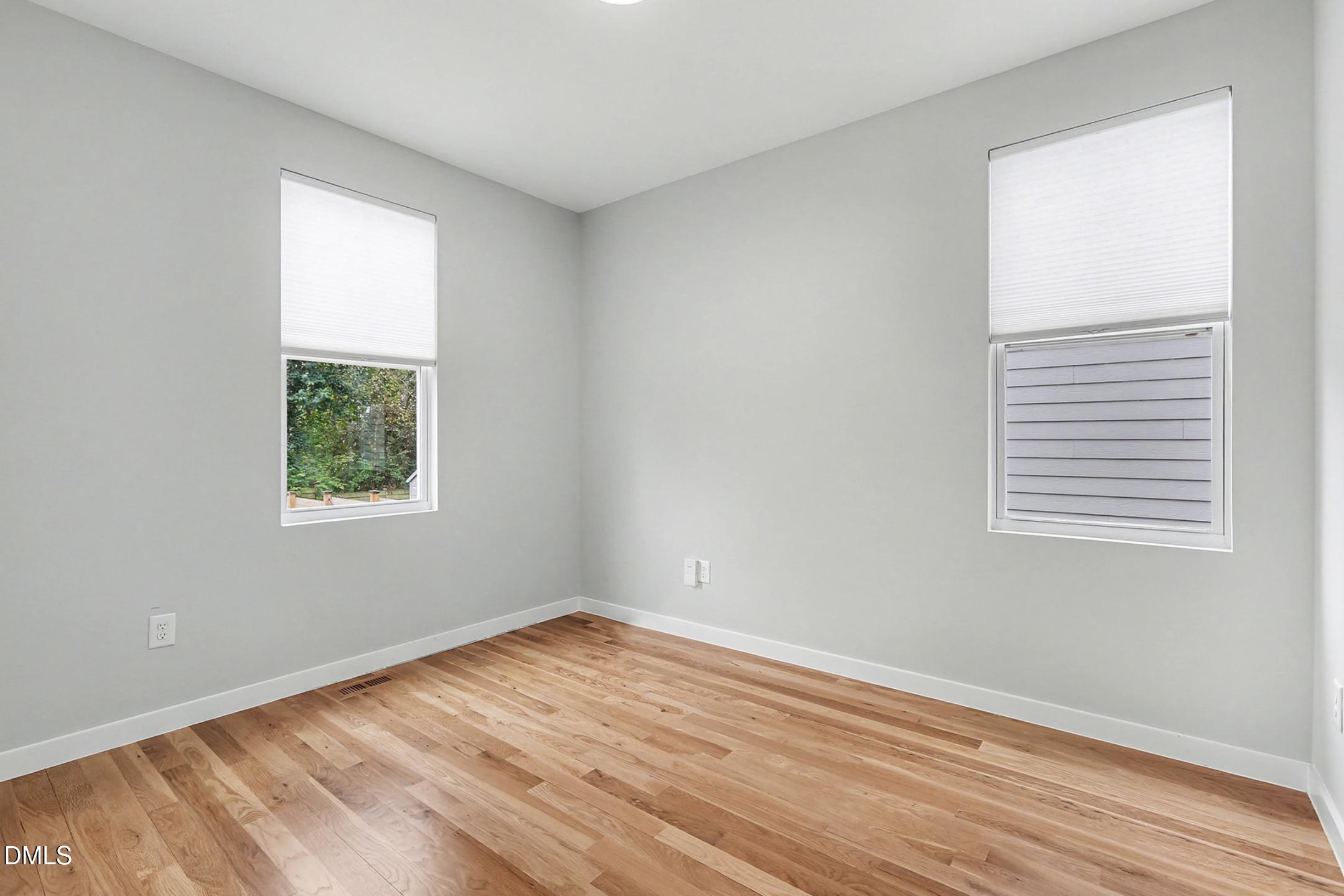 1508 East Jones Street Raleigh, NC 27610 - Photo 33 of 38 a view of a room with wooden floor and windows