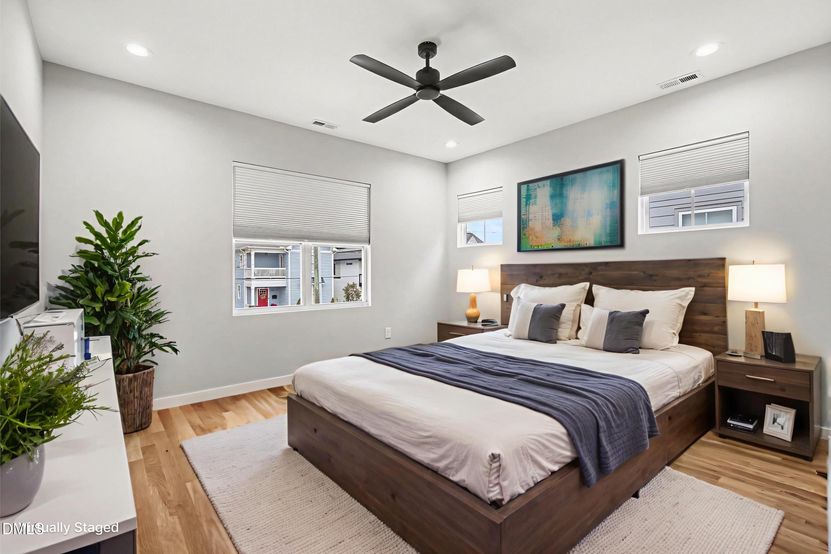 1508 East Jones Street Raleigh, NC 27610 - Photo 5 of 38 a bedroom with a large bed and a chandelier