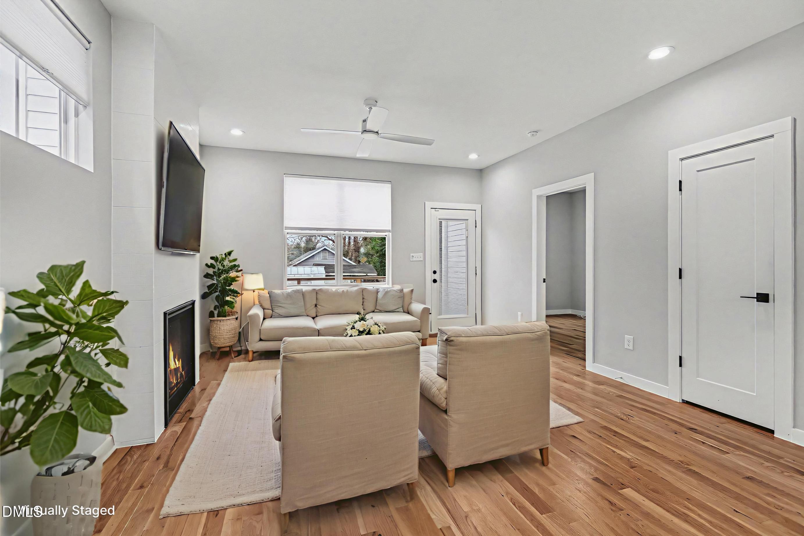 1508 East Jones Street Raleigh, NC 27610 - Photo 9 of 38 a living room with furniture and a potted plant