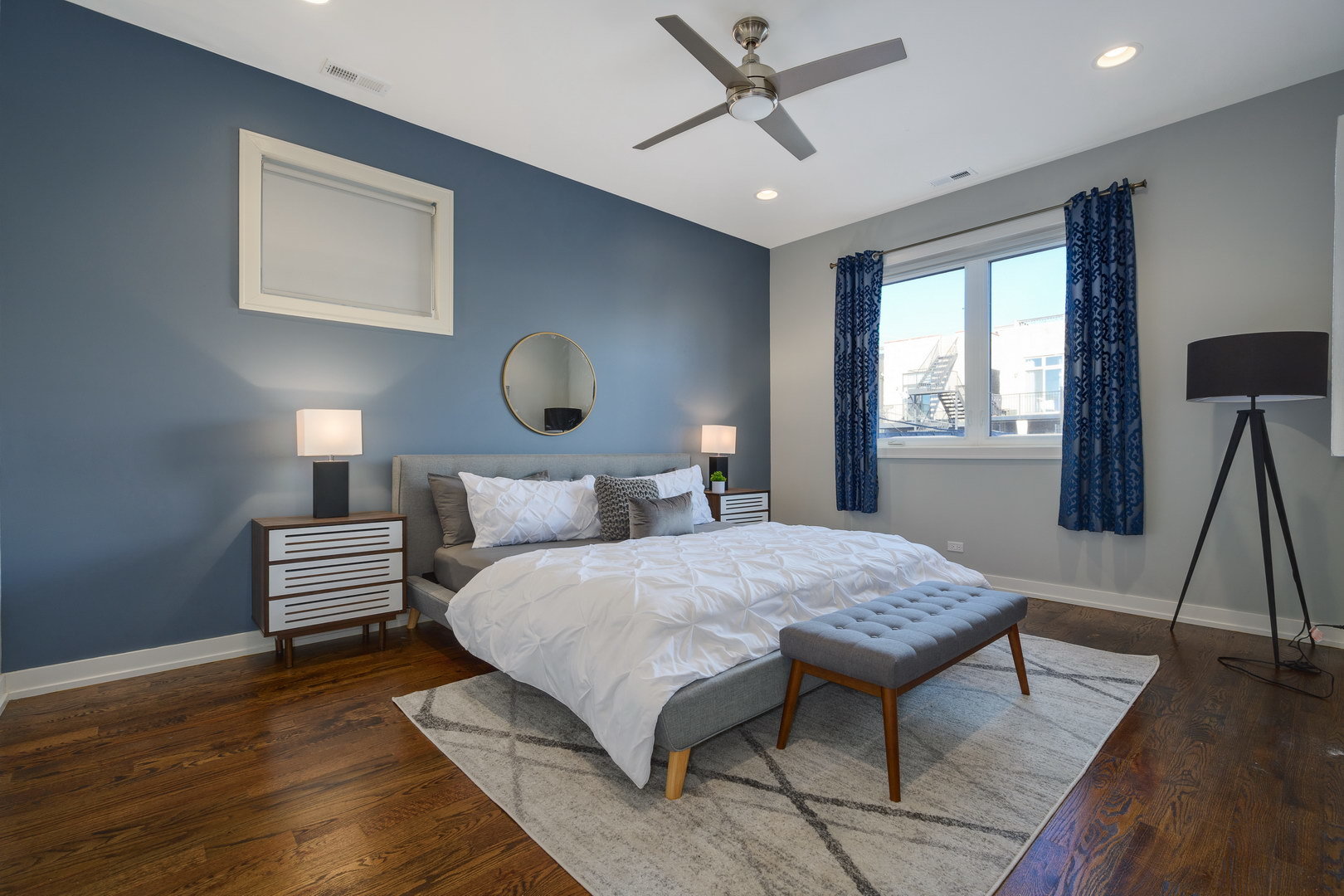 1832 West Rice Street, Unit 2 Chicago, IL 60622 - Photo 14 of 29 a bedroom with a bed and a chandelier