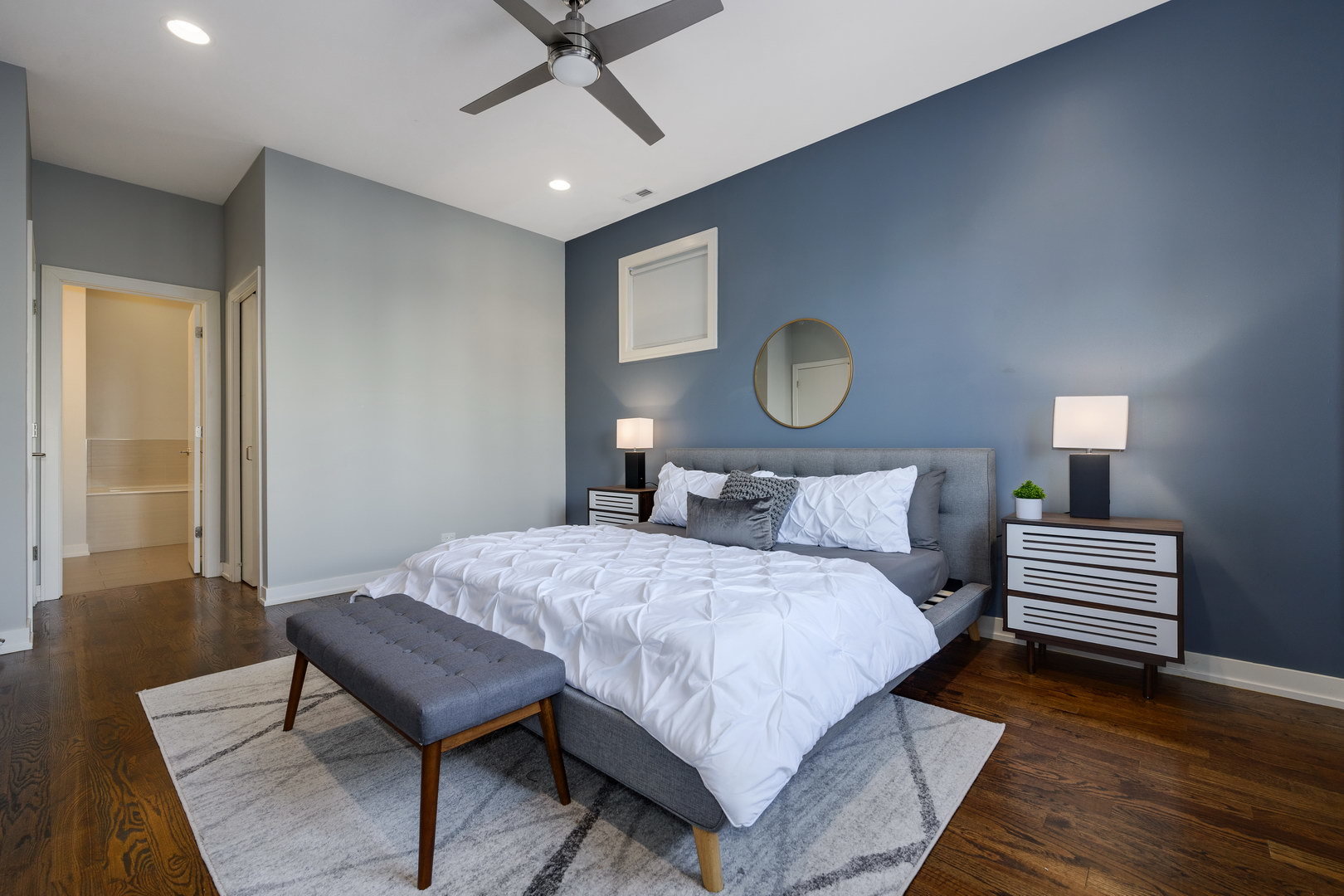 1832 West Rice Street, Unit 2 Chicago, IL 60622 - Photo 19 of 29 a bedroom with a bed and wooden floor