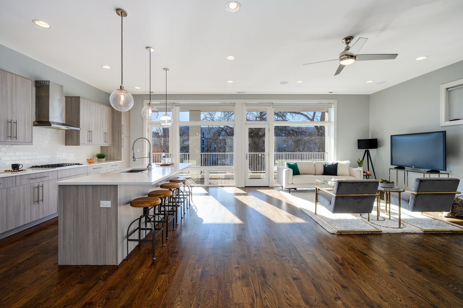 1832 West Rice Street, Unit 2 Chicago, IL 60622 - Photo 2 of 29 a living room with furniture a flat screen tv and wooden floor