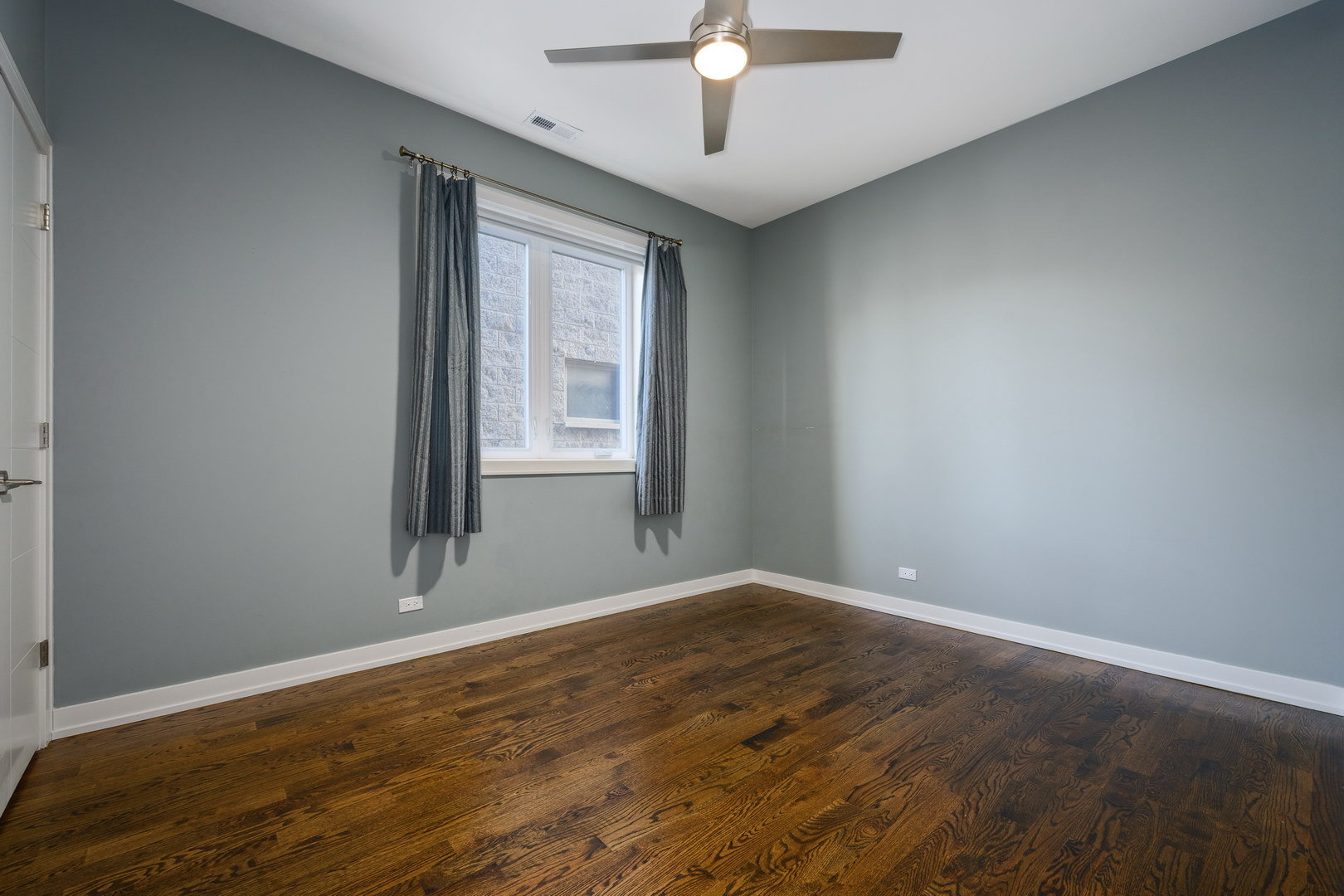 1832 West Rice Street, Unit 2 Chicago, IL 60622 - Photo 21 of 29 wooden floor in an empty room with a window