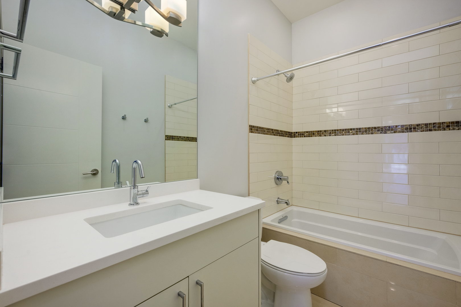 1832 West Rice Street, Unit 2 Chicago, IL 60622 - Photo 22 of 29 a bathroom with a sink a toilet and a bathtub