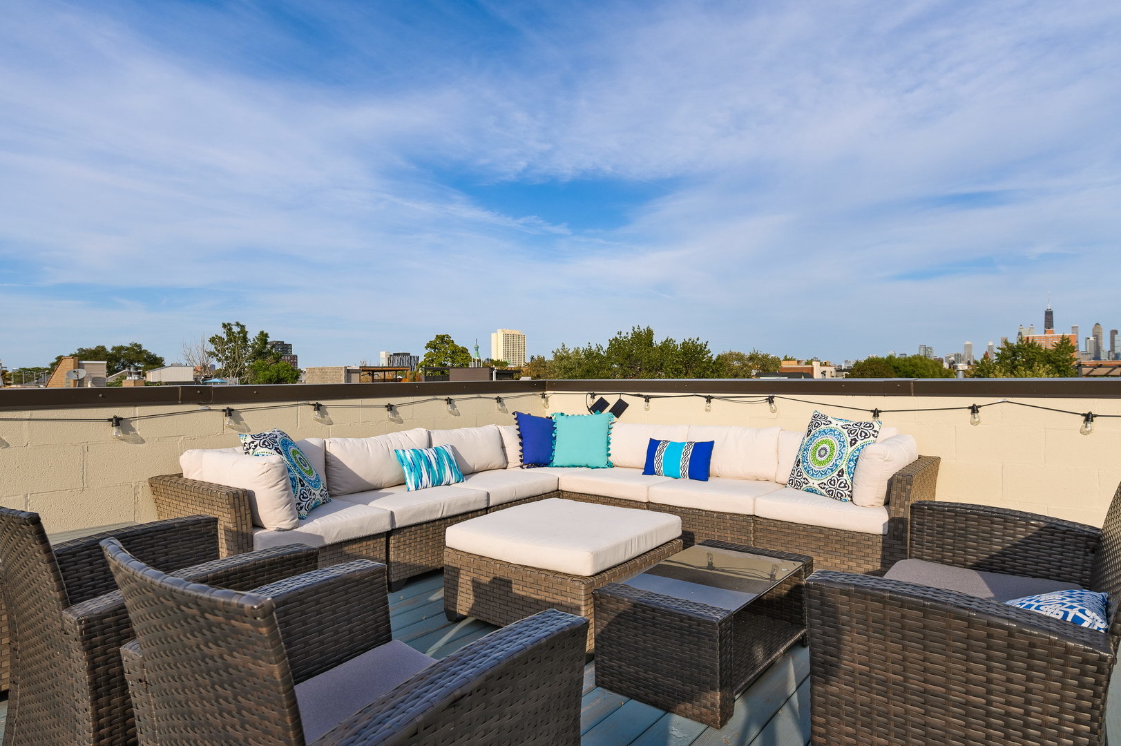 1832 West Rice Street, Unit 2 Chicago, IL 60622 - Photo 26 of 29 a roof deck with couches and potted plants