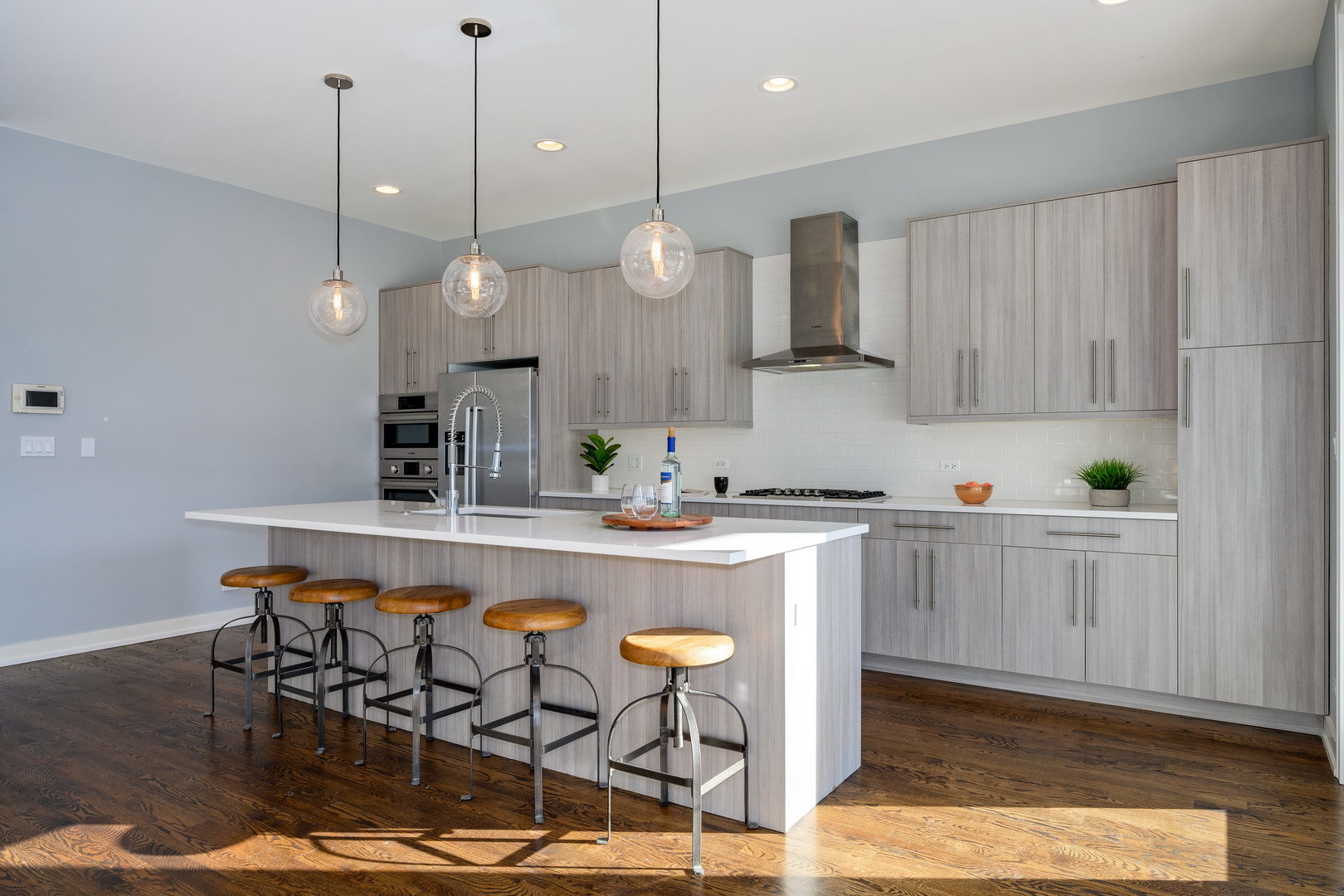 1832 West Rice Street, Unit 2 Chicago, IL 60622 - Photo 9 of 29 a kitchen with a table and chairs in it