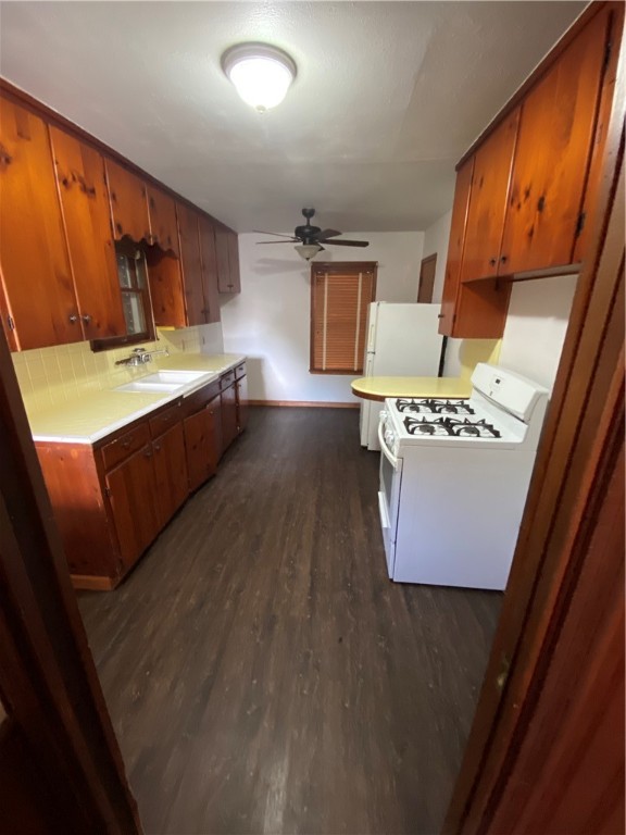 925 Stirman Street Corpus Christi, TX 78411 - Photo 3 of 16 a view of kitchen with a sink a mirror and wooden floor